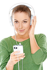 Image showing Young woman listening to her music