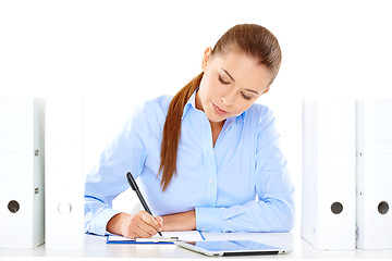 Image showing Efficient businesswoman working at her desk