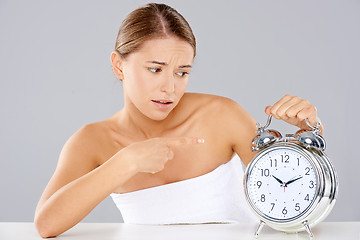 Image showing Bored young woman counting down the time