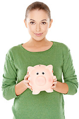 Image showing Woman with her piggy bank