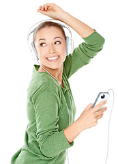 Image showing Happy woman dancing to her music