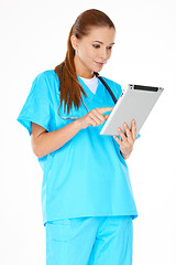 Image showing Doctor checking information on a tablet