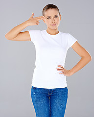 Image showing Woman making a handgun gesture