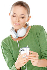 Image showing Woman searching her downloaded audio files
