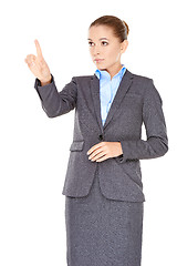 Image showing Businesswoman pointing and looking up