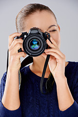 Image showing Female photographer taking a photo