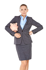 Image showing Businesswoman with a piggy bank