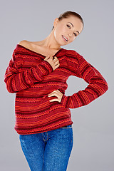 Image showing Sexy woman in a red winter top