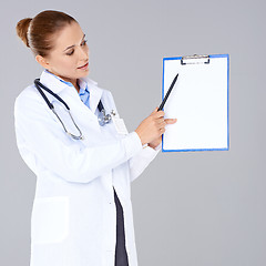 Image showing Female doctor or nurse with a clipboard