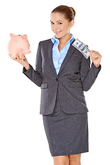 Image showing Successful businesswoman with a piggy bank