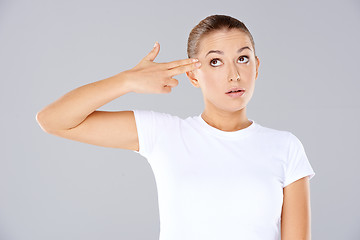 Image showing Woman making a handgun gesture