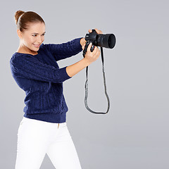 Image showing Pretty vivacious young female phoptographer