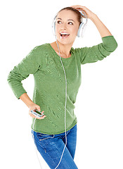 Image showing Blissful woman dancing and listening to music