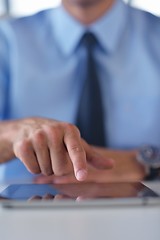 Image showing business man using tablet compuer at office