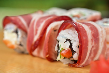 Image showing Sushi roll with bacon