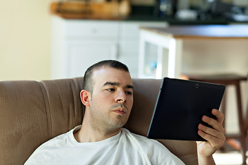 Image showing Man Reading a Tablet Computer
