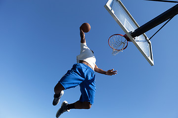 Image showing Man Dunking a Basketball