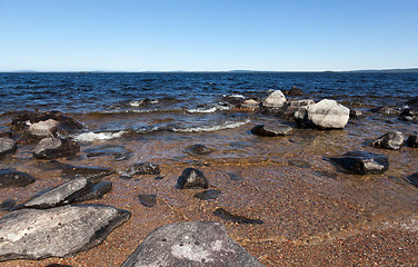 Image showing Large gray rocks on the shore of Lake