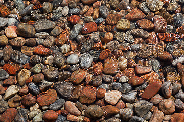 Image showing Multi-colored rocks on the shore of Lake