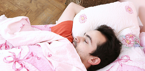 Image showing Young man sleeping .