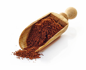 Image showing wooden scoop with ground coffee