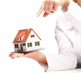 Image showing hand holding house isolated on white background