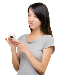 Image showing Asian woman read sms on phone