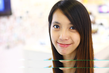 Image showing young woman smiling friendly