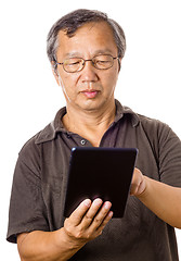 Image showing Asian old man using tablet