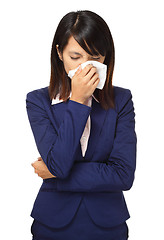 Image showing Cold sneezing asian business woman