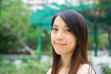 Image showing young woman smiling friendly
