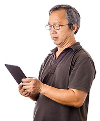 Image showing Asian man using tablet