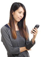 Image showing Asian woman read sms on phone