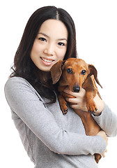 Image showing asian woman with dachshund dog 