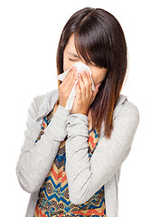 Image showing Cold sneezing asian woman