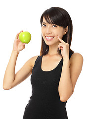 Image showing Asian woman with green apple and toothy smile