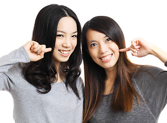 Image showing Two asian woman friend smile