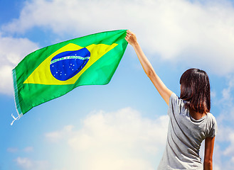 Image showing Woman holding a brazil flag