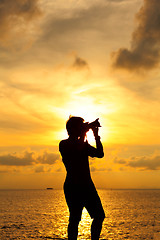 Image showing Silhouette photographer at sunset