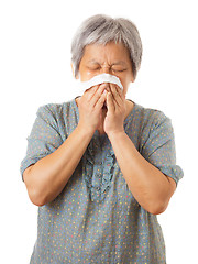 Image showing Sneezing asian elderly woman