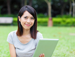 Image showing Asian woman holding tablet