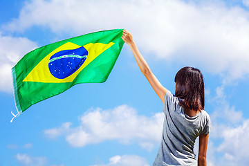 Image showing Woman holding a brazil flag