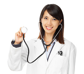 Image showing Asian female doctor holding stethoscope