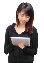 Image showing Young asian woman using tablet computer