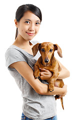 Image showing Asian woman with dachshund dog