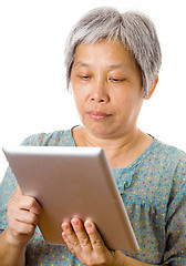 Image showing Asian elderly using tablet