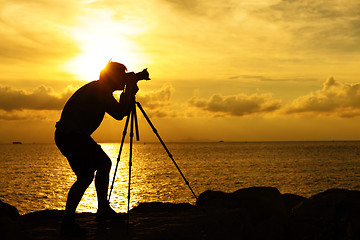 Image showing Silhouette photographer at sunset