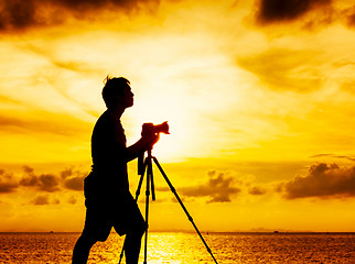 Image showing Silhouette of photographer at sunset