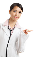 Image showing Asian doctor pointing a side