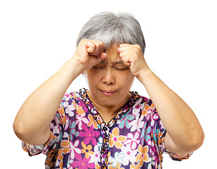 Image showing Mature asian woman serious headache